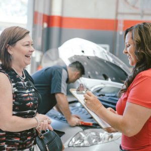 Woman receiving her courtesy car from Kellie at Daniels Automotive