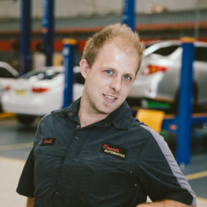 Isaac the motor mechanic at Daniels Automotive head shot photograph