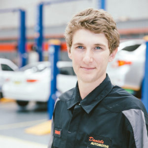 Travis a motor mechanic at Daniels Automotive head shot photograph